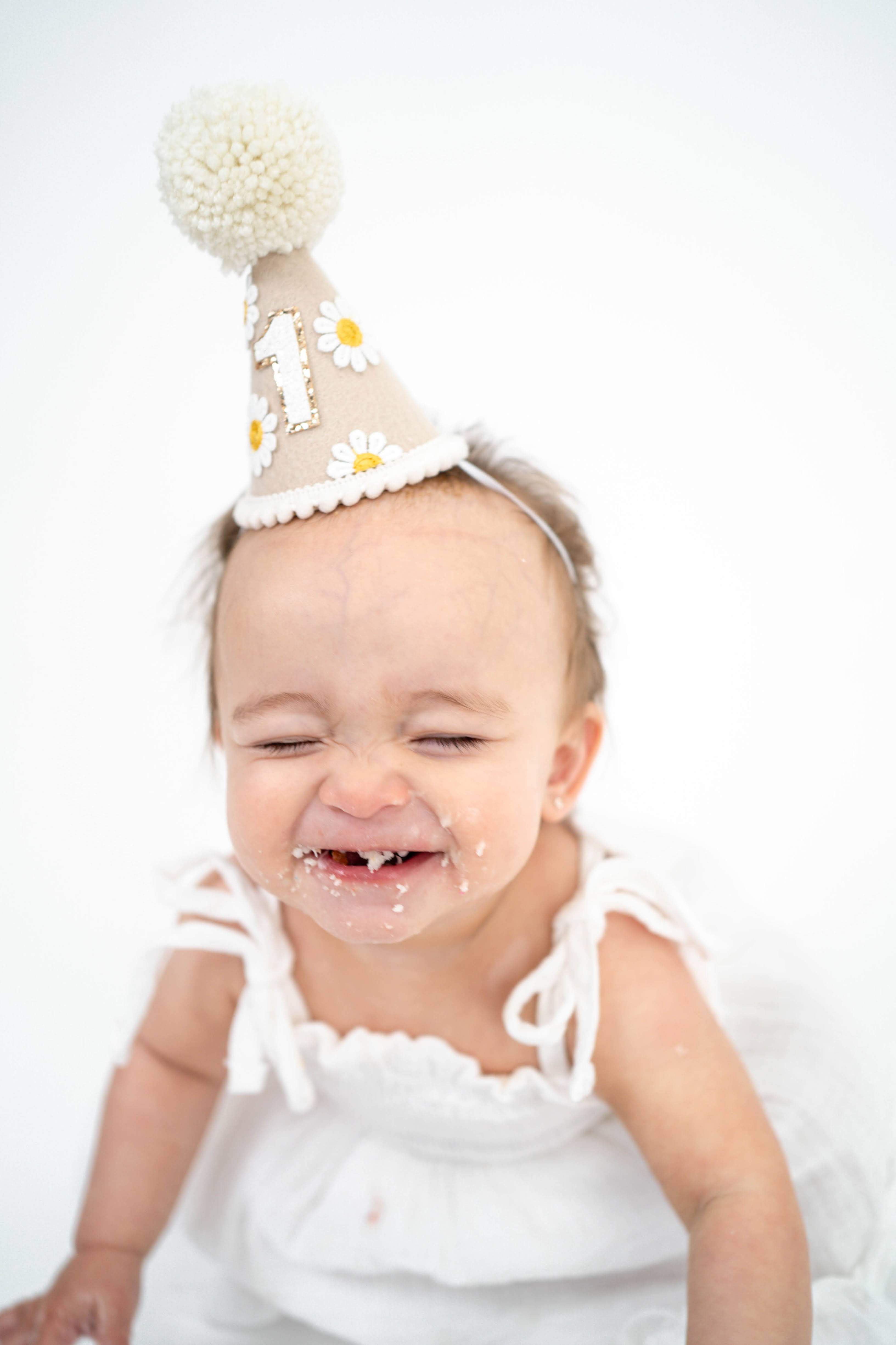 One-year-old smiling during a Vacaville birthday photography session.