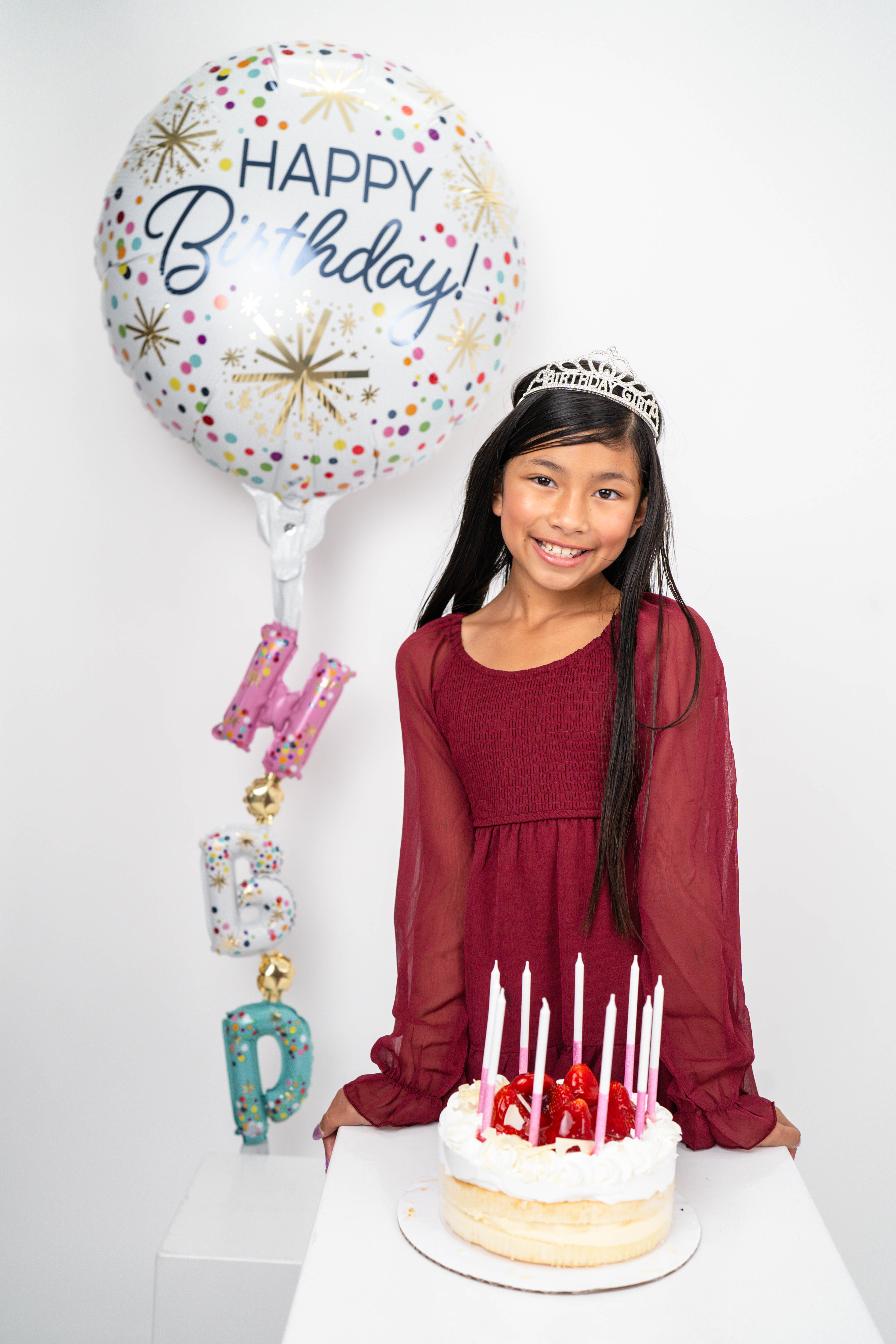 Toddler sitting near a birthday cake during a Solano County milestone session.