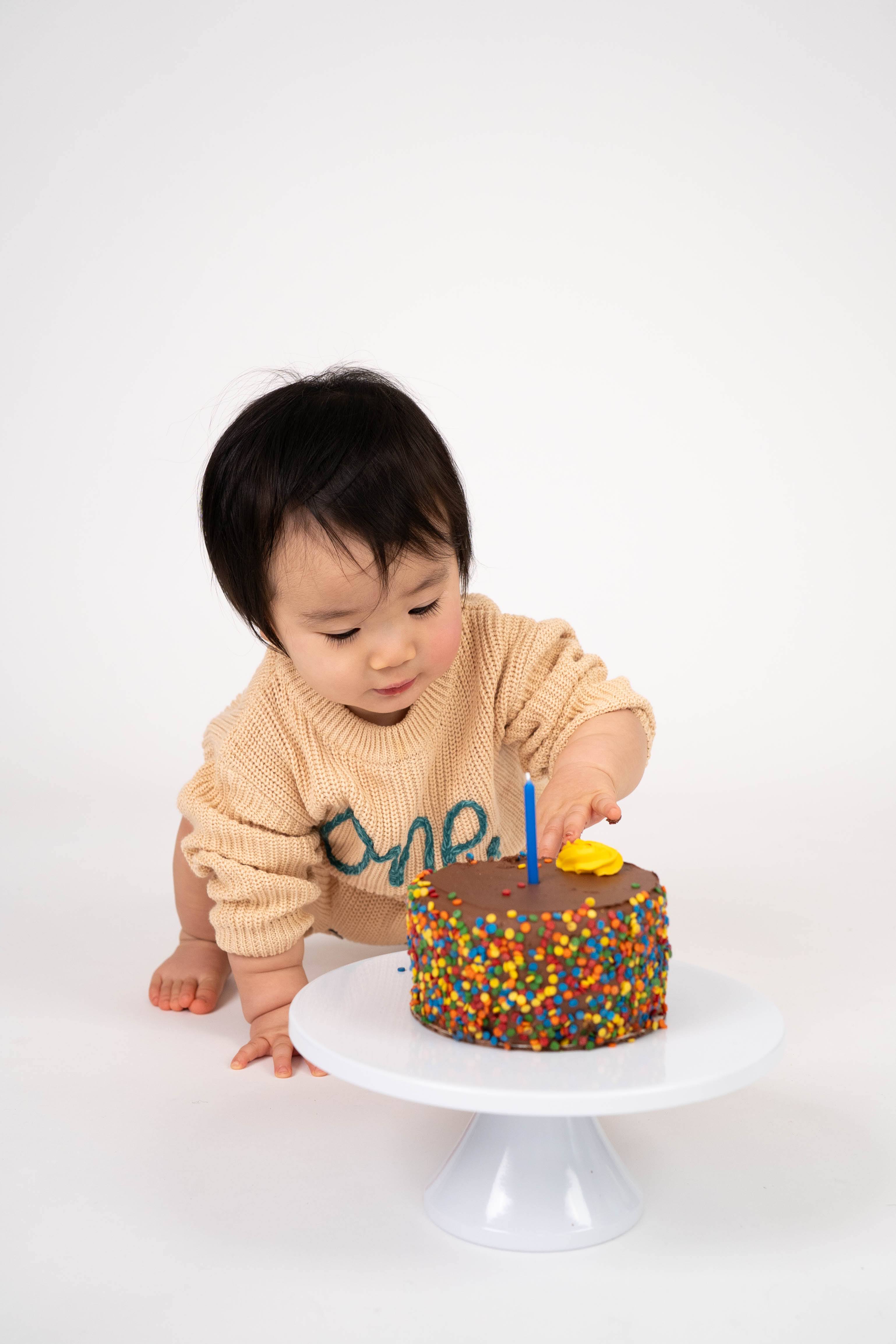 Child laughing during a playful birthday portrait session in Vacaville.