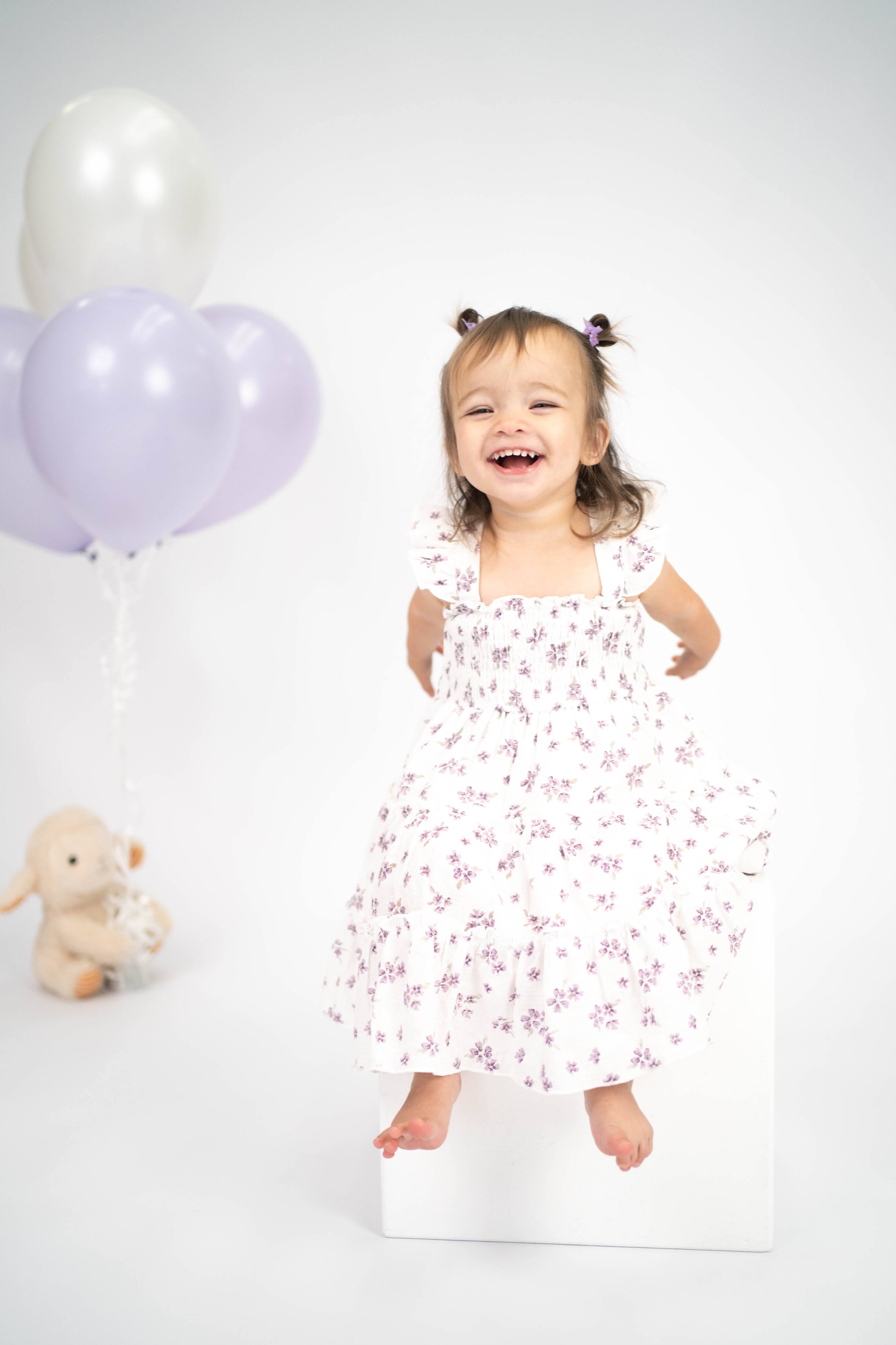 Child celebrating a first birthday with soft studio styling during a Vacaville session.