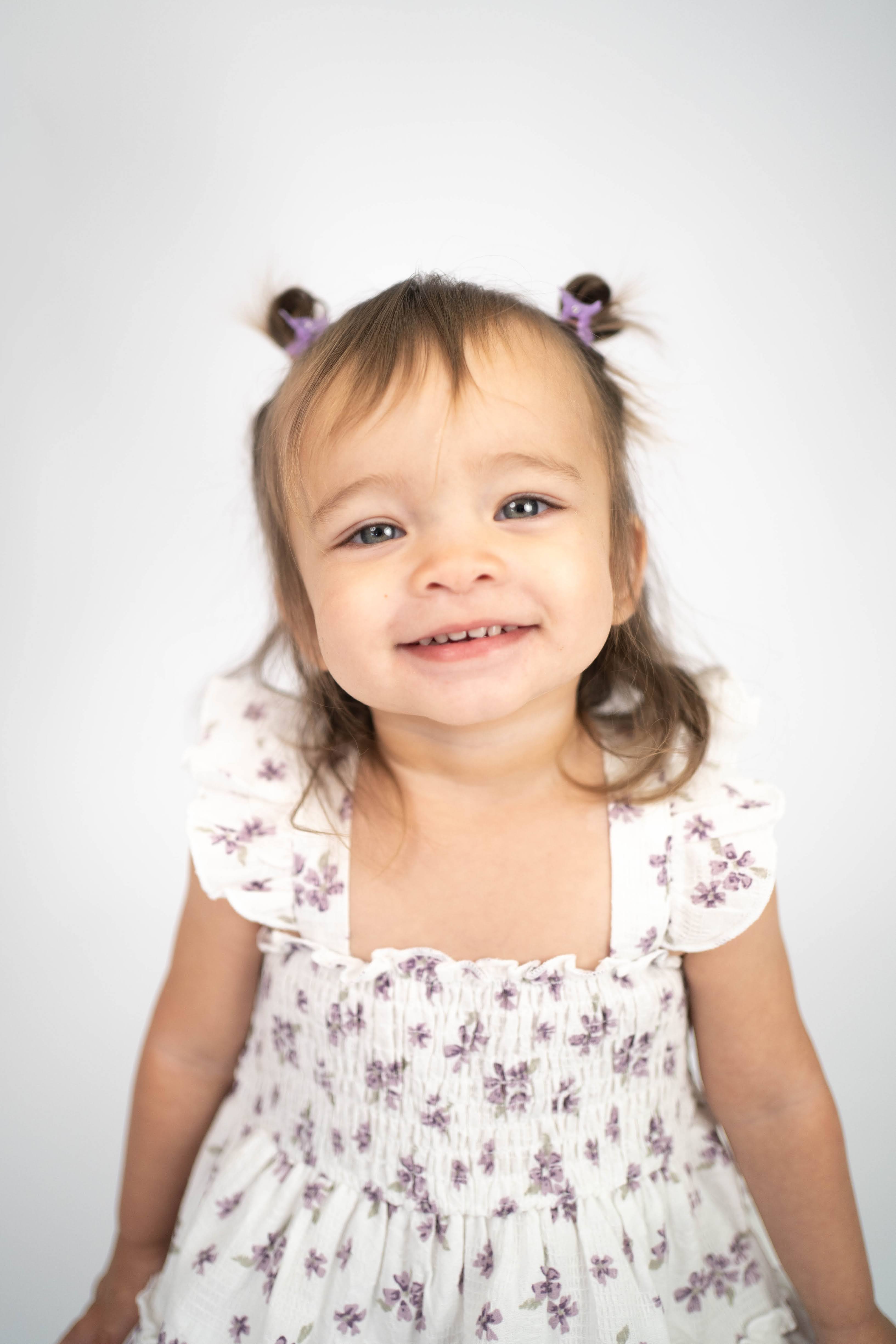 Child sitting for a simple portrait during a Solano County family and kids session.
