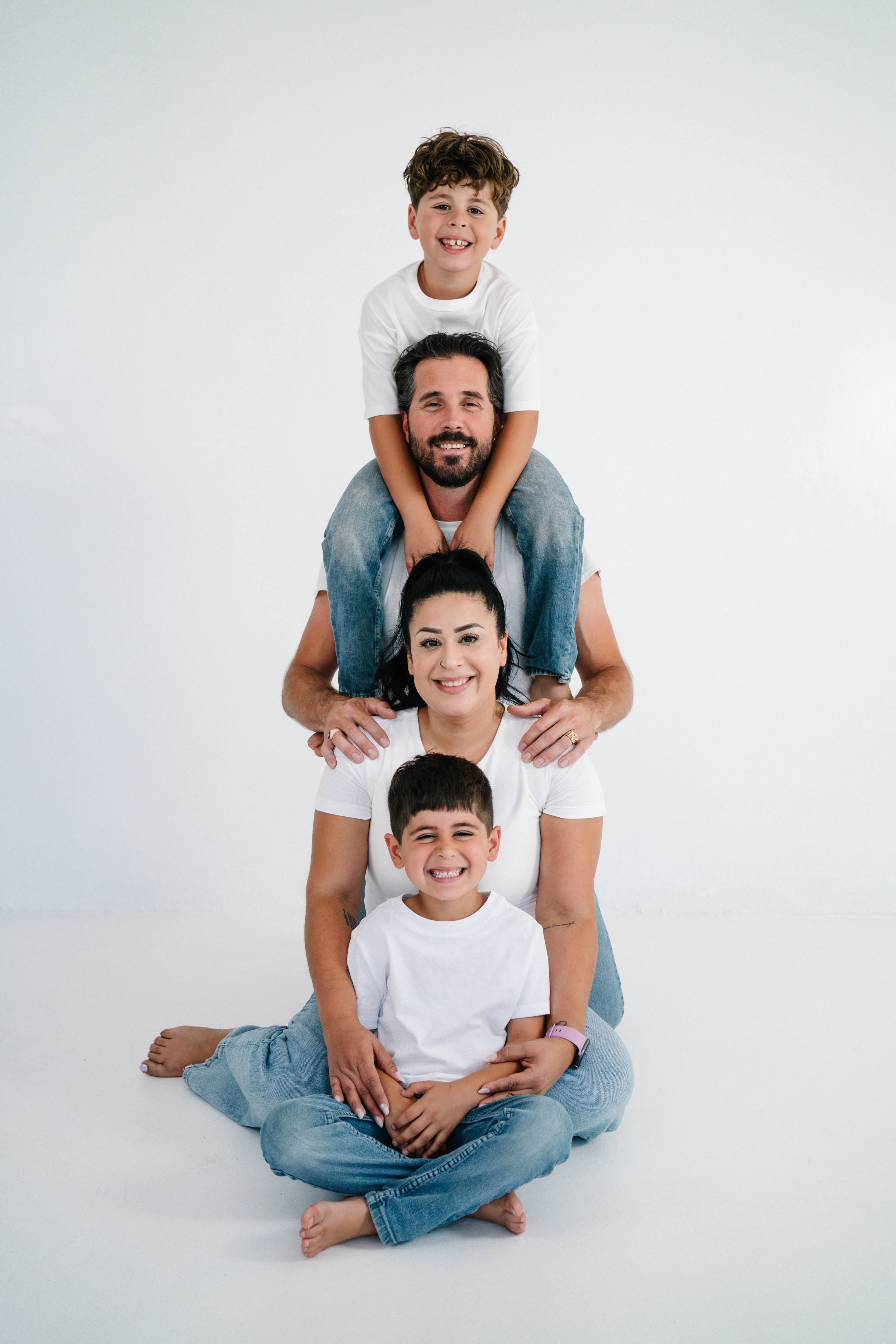 Little one smiling during an indoor family portrait session in Vacaville.