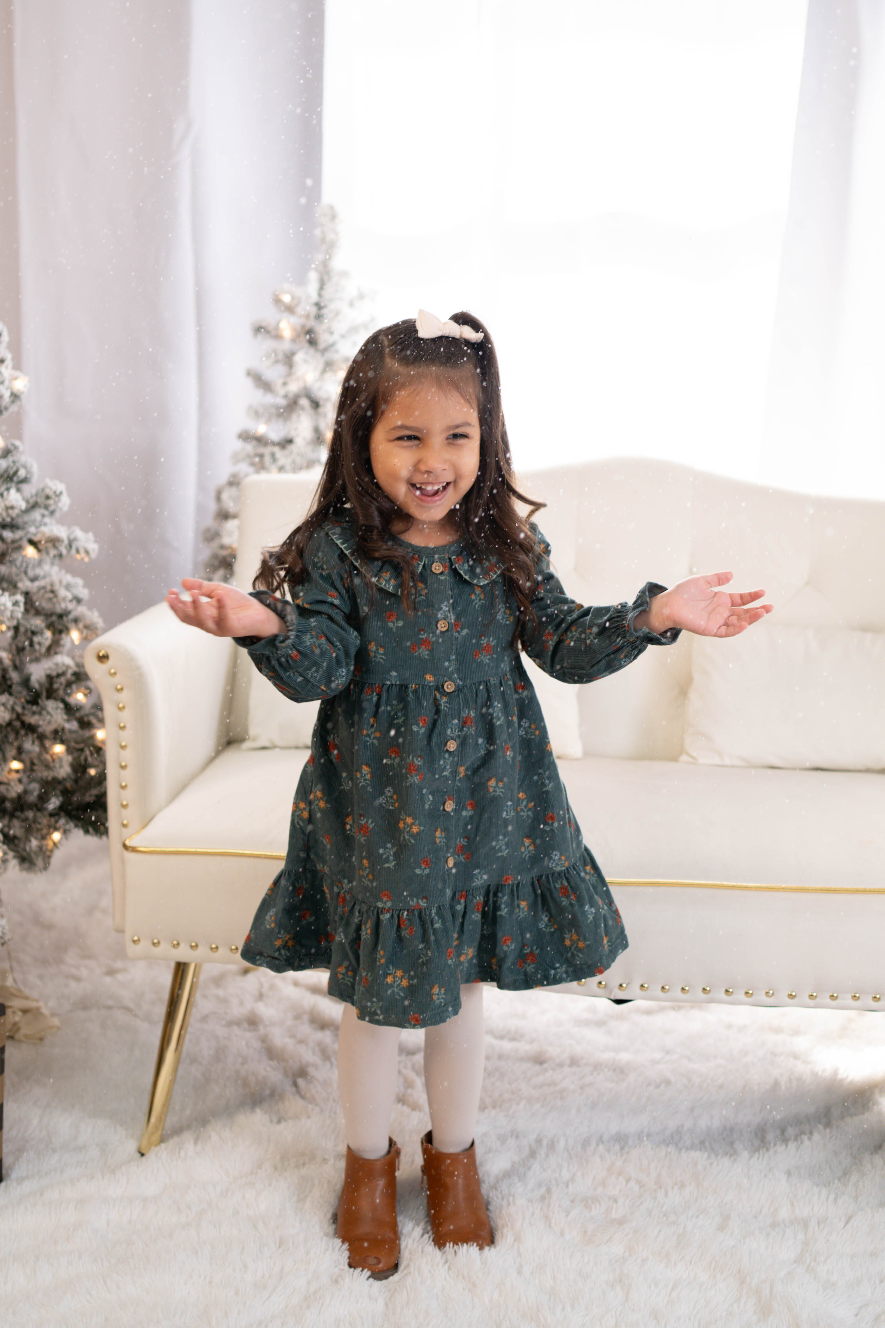 Child sitting in a cozy studio setup during a Vacaville kids photography session.