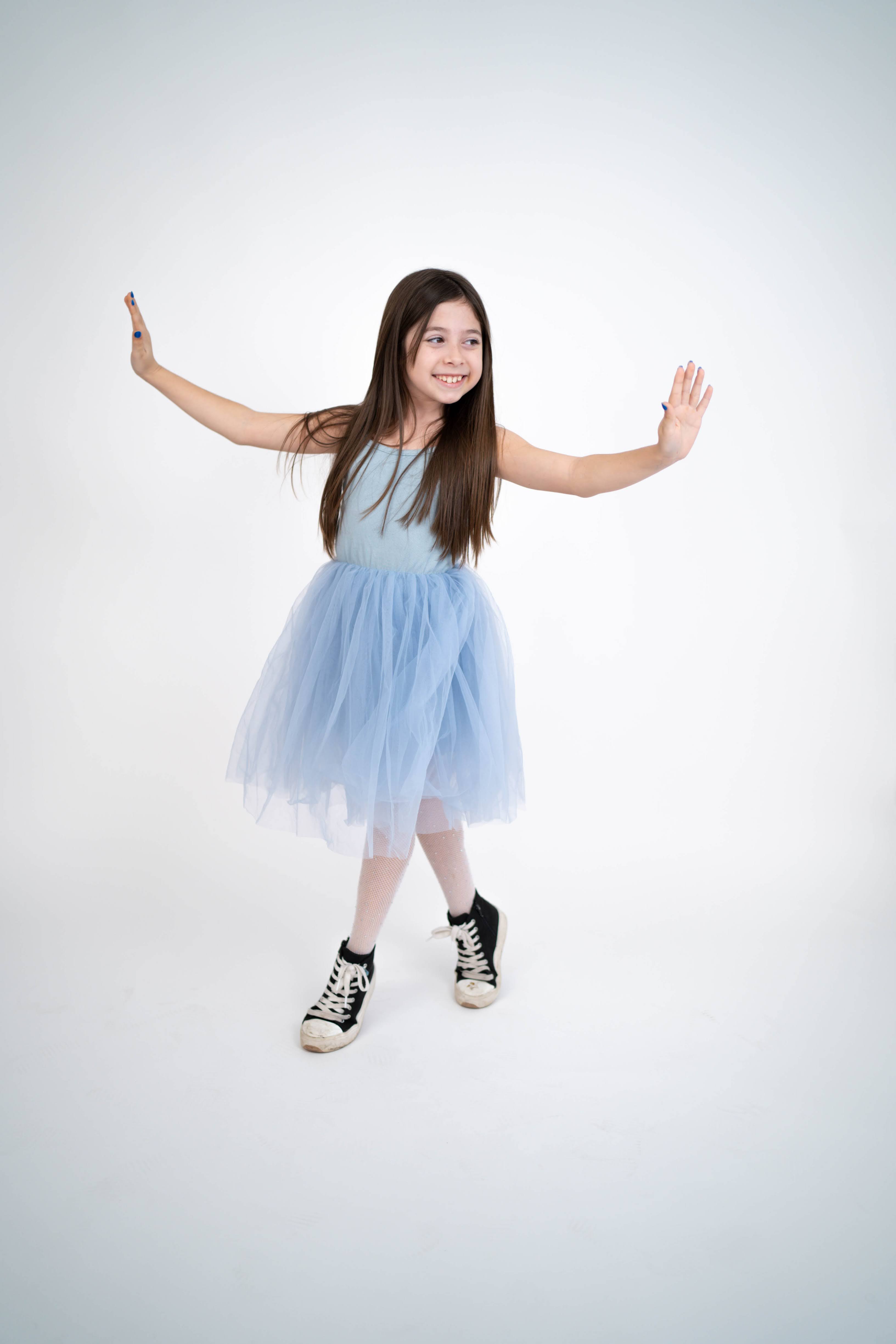 Child smiling during a playful family portrait session in Vacaville.