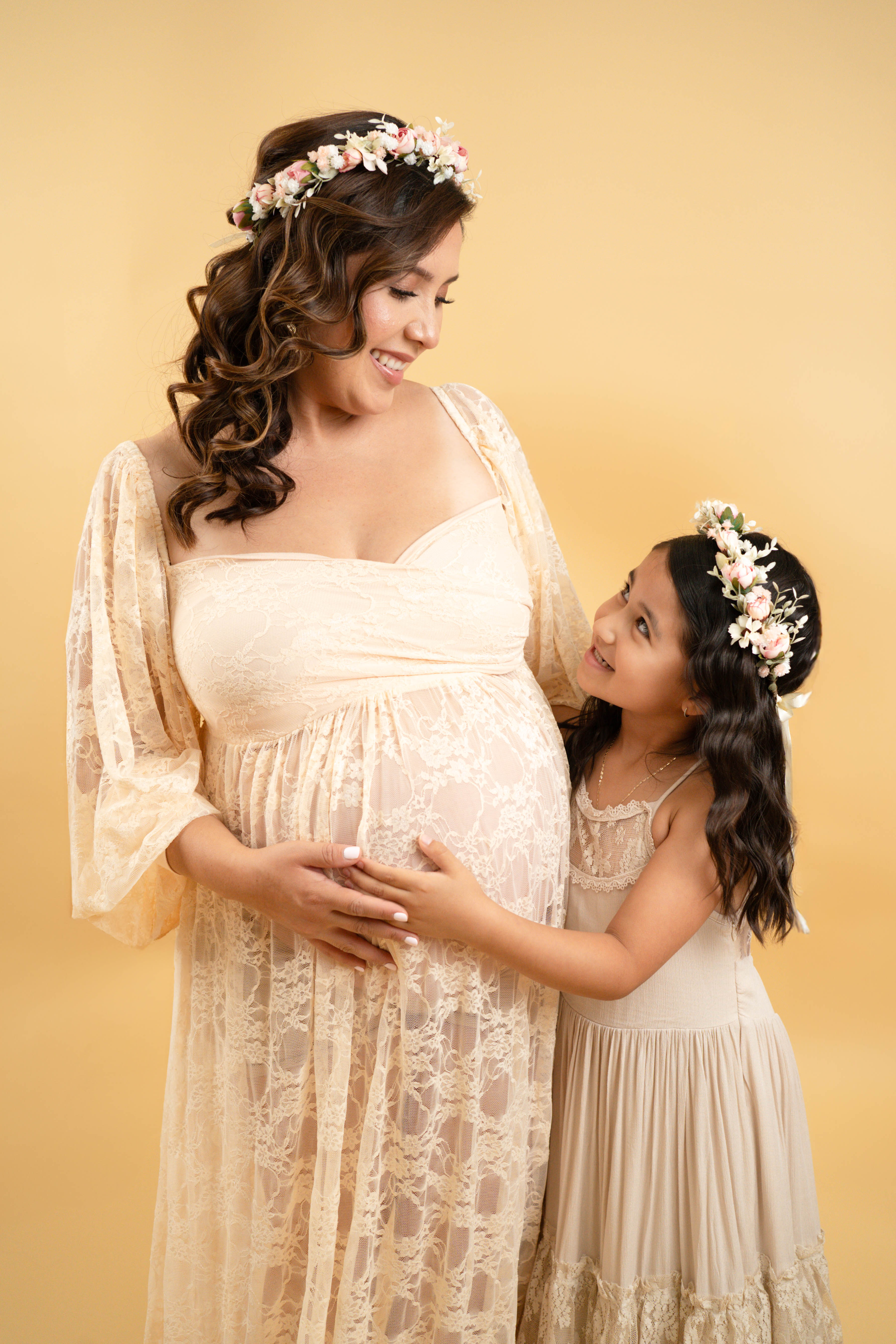 Maternity portrait in a field with warm natural light during a Solano County photo session.