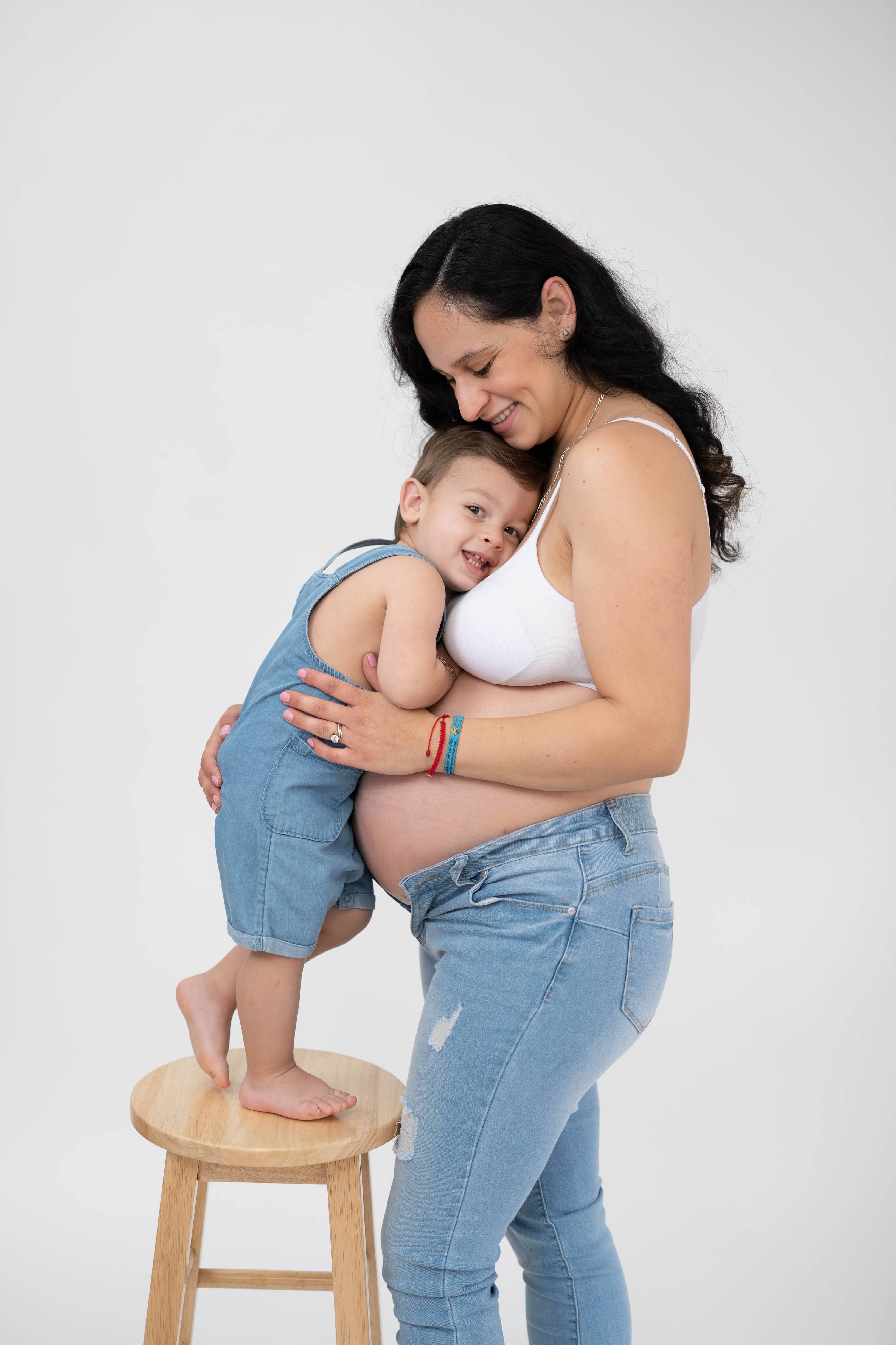 Expecting mother standing in a field during a Solano County maternity photography session.