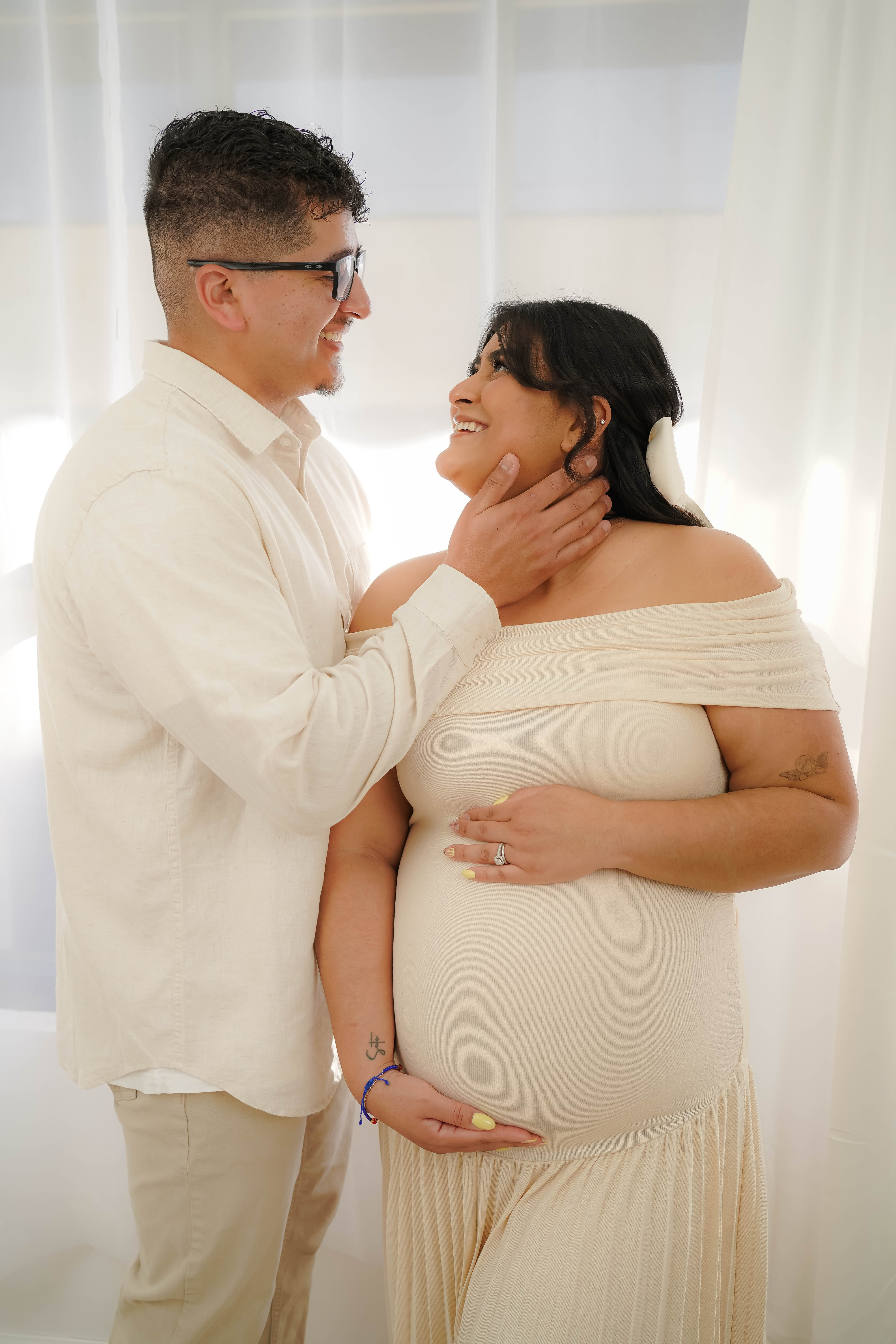 Expecting mother smiling during a natural-light maternity session in Solano County.