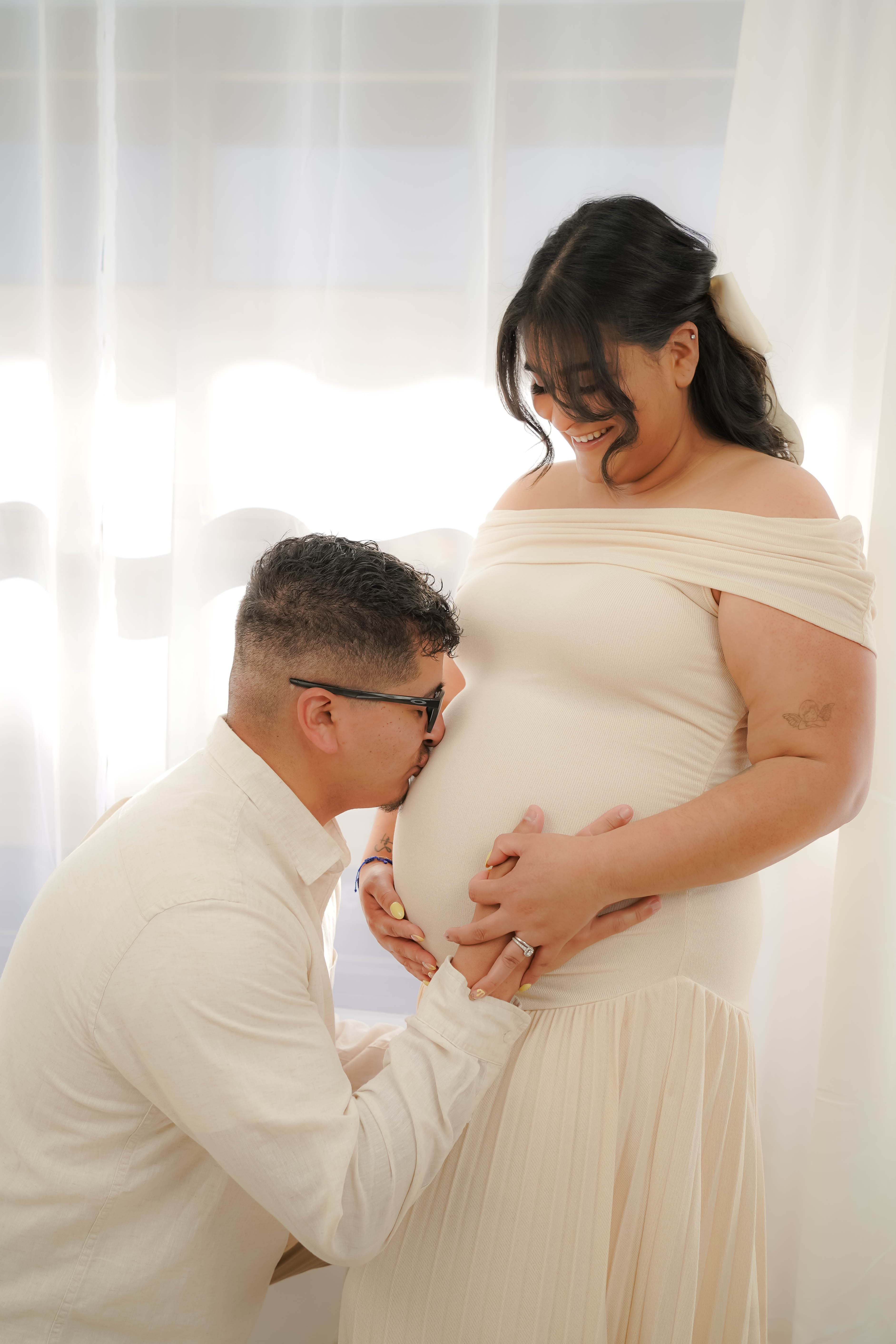 Maternity portrait with soft greenery and warm tones during a Vacaville photo session.